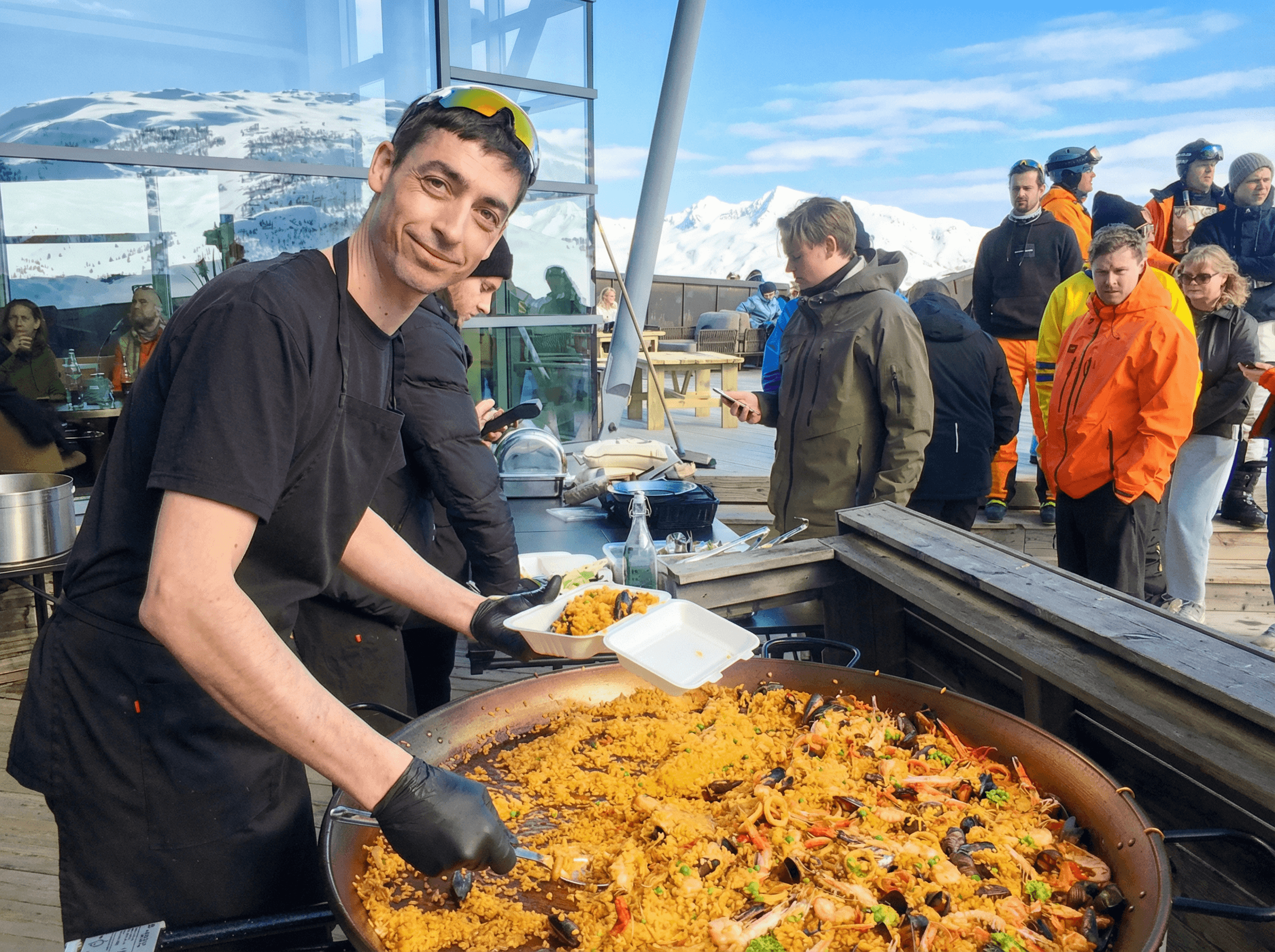 Paella cooking over open flame